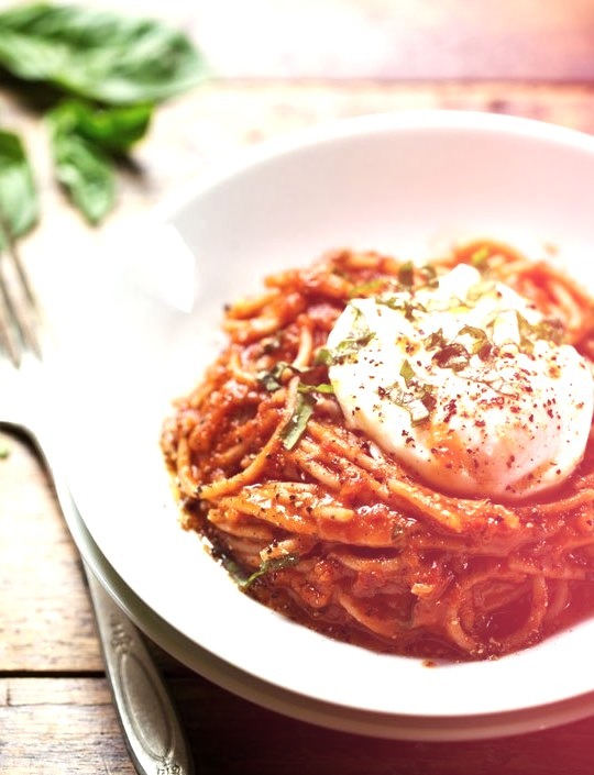 spaghetti marinara with poached eggs